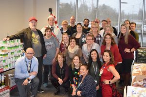 Summit Pacific staff gathered to prepare meal packs that were donated to local families in need though their Summit Fights Hunger Program