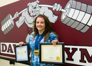Corrie Stewart displays medals and awards that she recently won for her world record lifts.