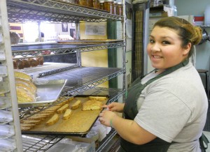 Yanela Castenada of Nancy's Bakery tends to a batch of biscotti.