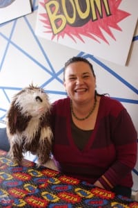 Carol sits with Scruffers, her read-aloud sidekick.