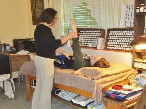 Jane Reibel demonstrates muscle testing.