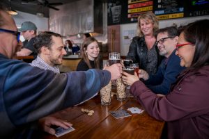 City of Aberdeen Brewing Group with beer at Steam Donkey