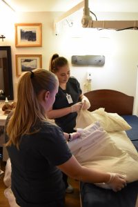 GHCH Community Partnerships making bed