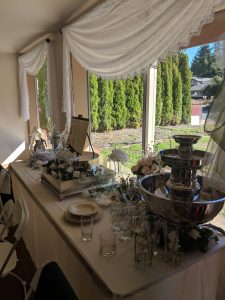 table filled with desserts under a white tent