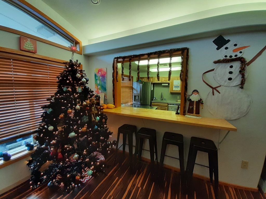 Christmas tree by a breakfast bar at the Coastal Community Action Program Youth Shelter