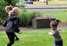 Library friends play together during an outdoor storytime hosted by Montesano Timberland Library.