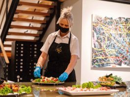 Bayview Catering worker setting up a plate of food