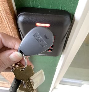 key fob being held against an entry pad