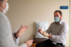 Dr. Kowalski speaking to a patient