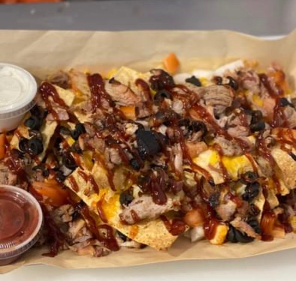 a big plate of nachos from Red Cedar Pub