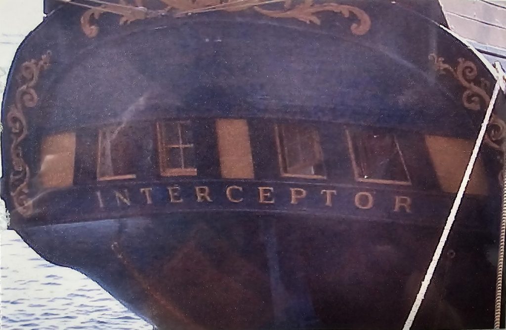 The back of the Lady Washington with the word 'Interceptor" on the back